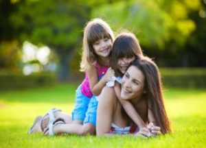 moms with kids playing